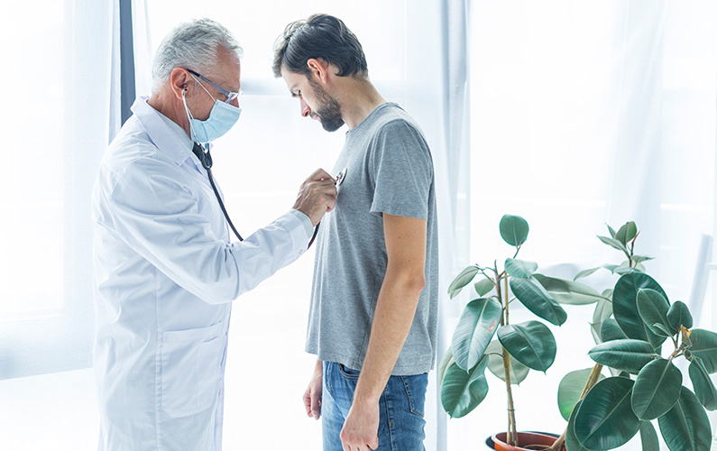 doctor-examining-chest-of-patient